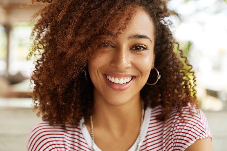 How a Mindful Smile Improves Your Happiness and Health