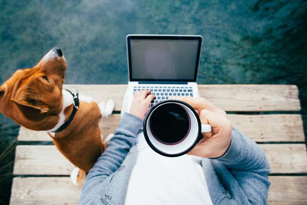 A Man with a Dog Beside Him