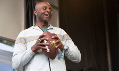 Jerry Rice Holding a Rugby Ball