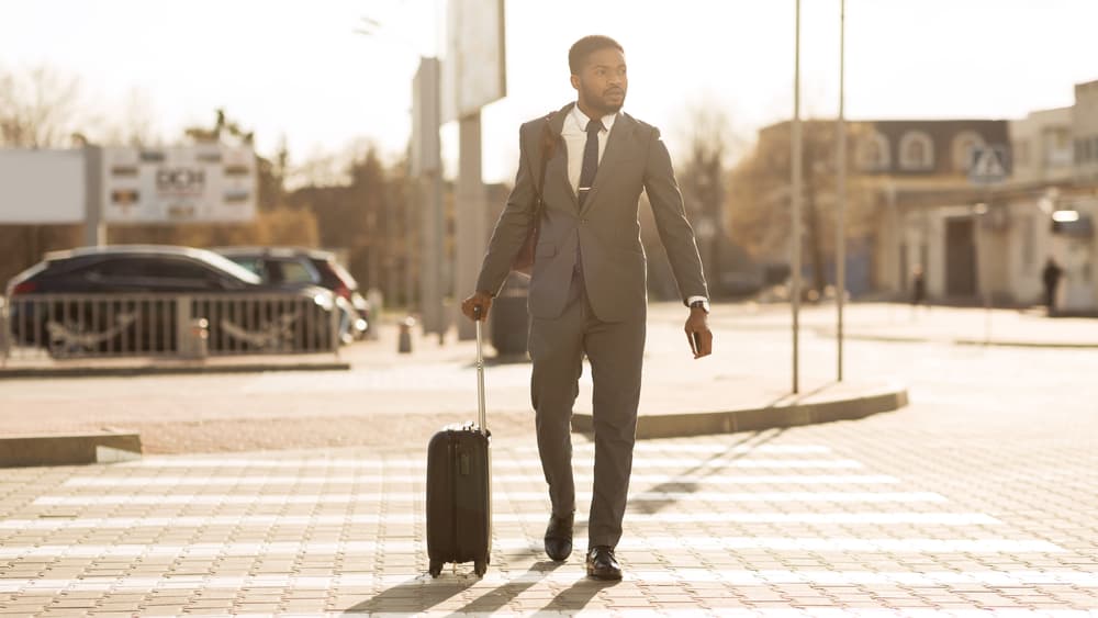 A Man Crossing in The Pedestrian Lane